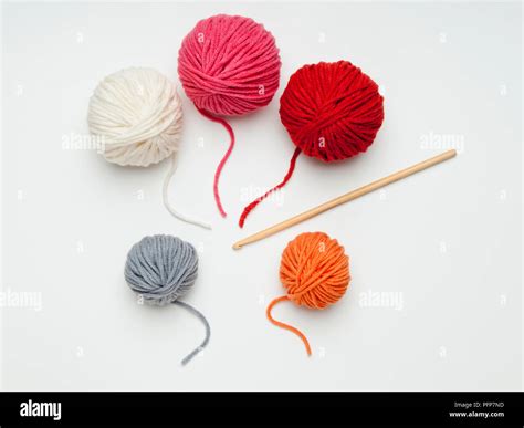 Balls of wool and crochet hook Stock Photo - Alamy