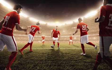 Soccer players in red soccer jersey playing soccer on soccer field HD ...