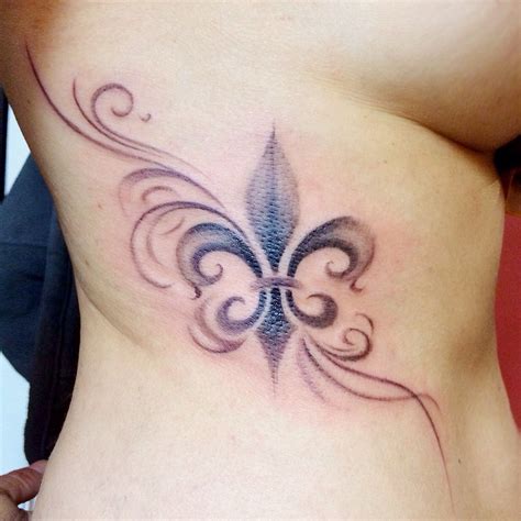 Soft fluerdelys de lys tattoo on side part | Tattoos, Small wrist ...