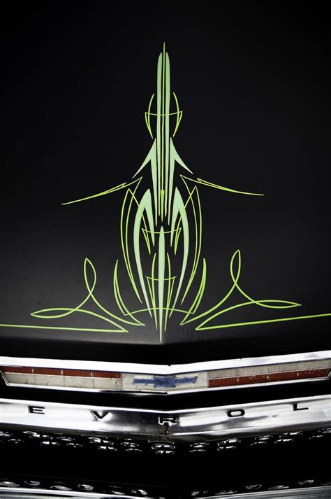 the front end of a car with an artistic design on it