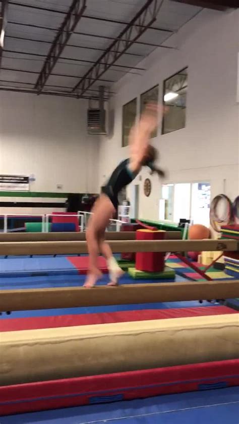 Gymnastics Girl Slips and Falls off Balance Beam | Jukin Media Inc