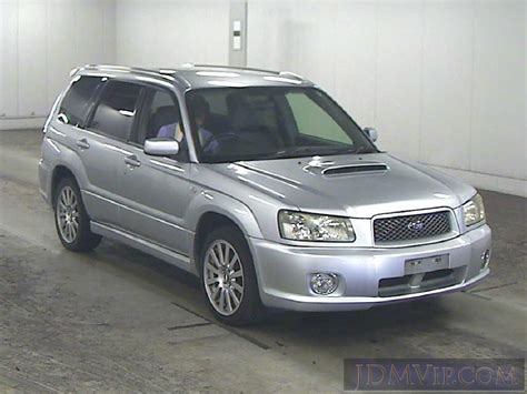 a silver suv parked in a parking garage