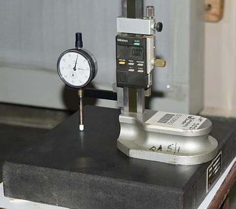 Calibration of dial gauge indicator on the surface plate. | Download ...