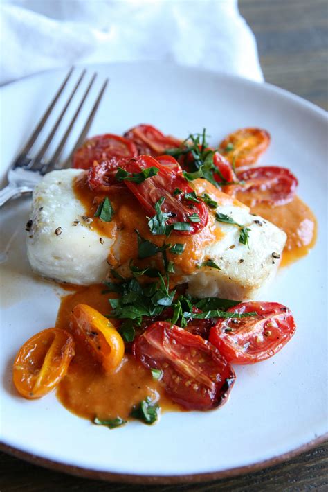 Roasted Cod with Tomato Cream Sauce Recipe - Delish.com