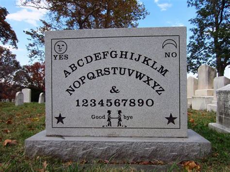 a headstone with the words and numbers on it in front of some tombstones