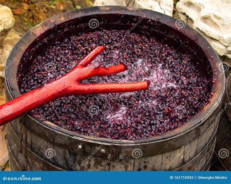 Red Wine Making In Process. Work Mixing Wine In The Process Of ...