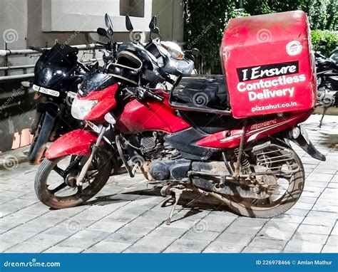 Wide Shot of Contactless Delivery Bike from Pizza Hut Showing the ...