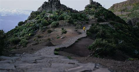 Person Hiking on Mountain Path · Free Stock Photo