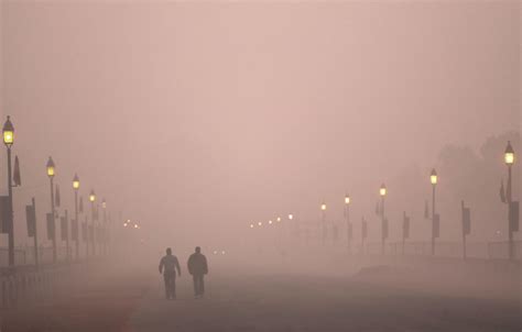 Firefighters spray water from high-rises to fight air pollution in ...