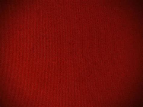 Dark red velvet fabric texture used as background. Empty dark red ...