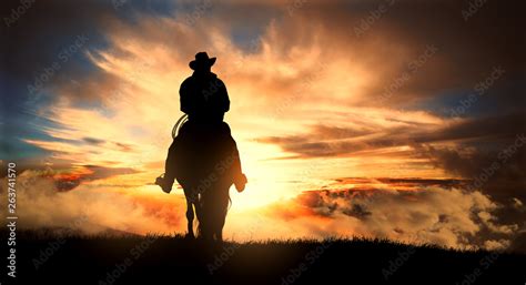 Cowboy On Horse Sunset