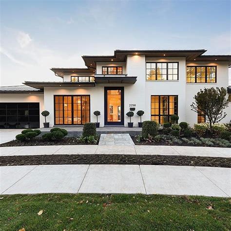 Modern white and black exterior. Black windows, painted white brick ...