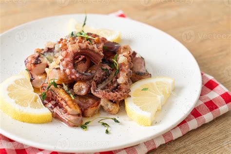 grilled octopus or squid with butter lemon sauce 4019827 Stock Photo at ...