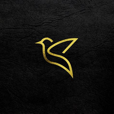 a black and gold logo with a bird on it