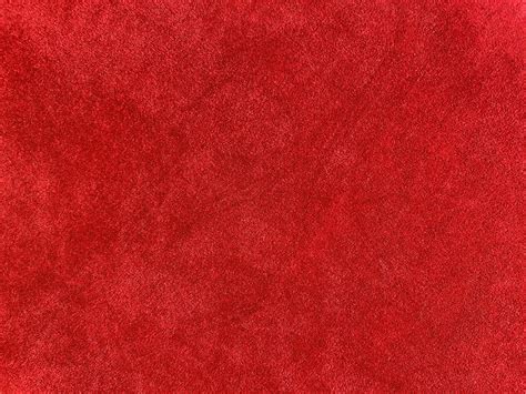 Dark red velvet fabric texture used as background. Empty dark red ...