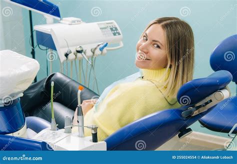 The Girl Smiles at the Dentist and Looks at Her Stock Photo - Image of ...