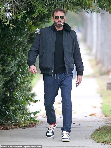 Ben Affleck smokes a cigarette during morning outing after debuting at ...