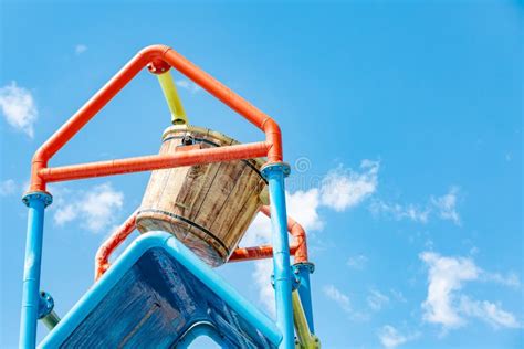 A Large Bucket of Water Splashing Down at a Water Park Stock Photo ...