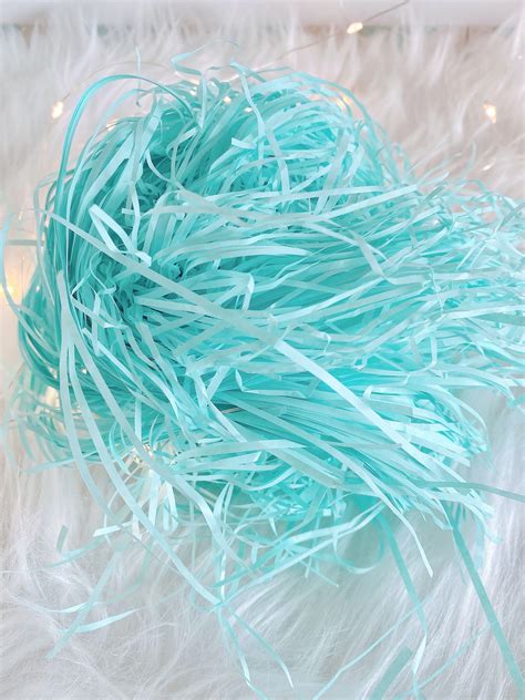 Shredded paper, confetti paper cushioning fill in baby blue for cake ...