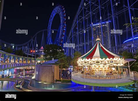 Tokyo Dome City Attractions amusement park at night Stock Photo - Alamy