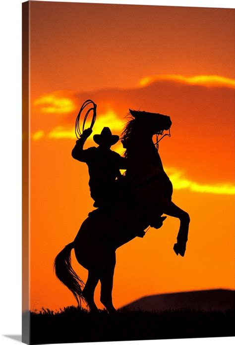 Silhouette of cowboy on horse rearing up Wall Art, Canvas Prints ...