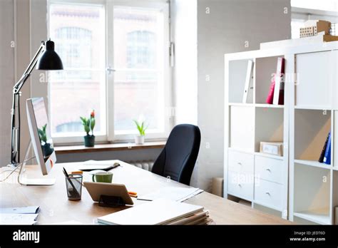 Desk in empty office Stock Photo - Alamy