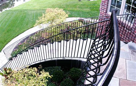 Outdoor Curved Staircase with Wrought Iron Belly Rail