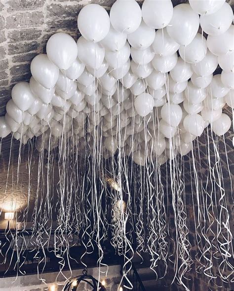 an instagram with balloons floating from the ceiling