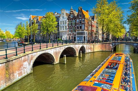 Amsterdam canals and bridges | Architecture Stock Photos ~ Creative Market