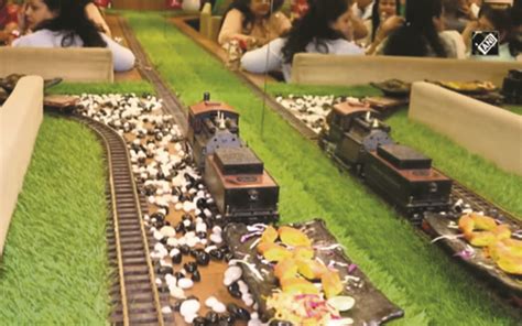 This Surat restaurant serves food on a toy train