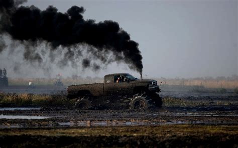 Download Diesel Truck Black Coal Smoke Mud Road Wallpaper | Wallpapers.com