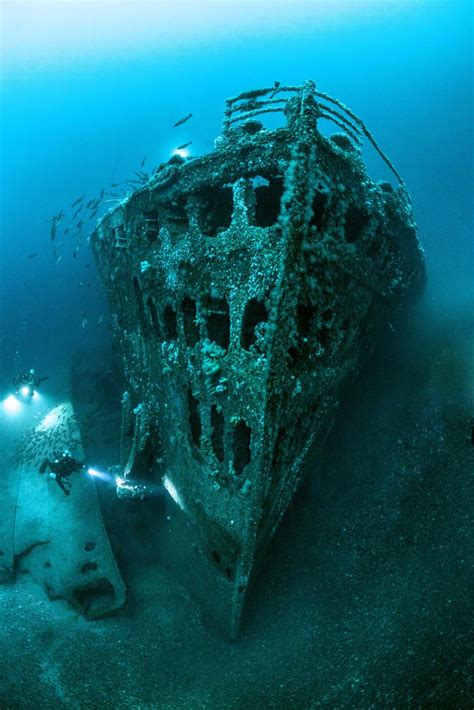 Stunning underwater snaps show wreckage of huge ship sunk by six ...