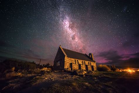 The Milky Way stretching across the sky over a little church at Lake ...