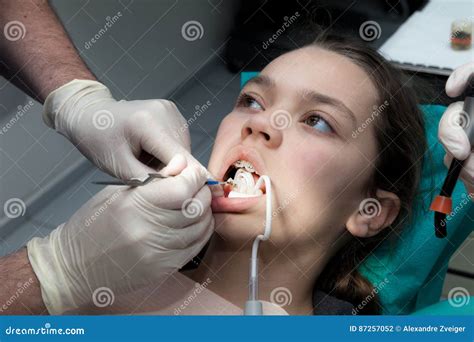 Girl by her dentist stock photo. Image of healthy, brace - 87257052