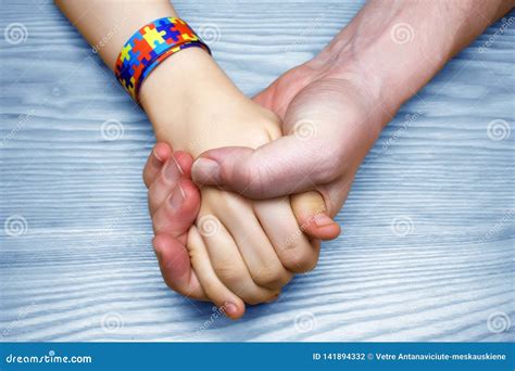 Autism Awareness Picture. Father Holding Hand Her Autistic Child Stock ...