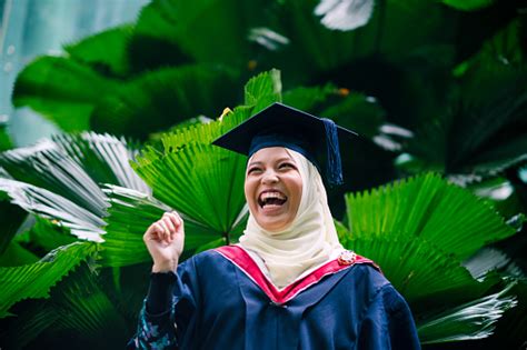 Portrait Of College Student Cheering On Her Graduation Day Stock Photo ...