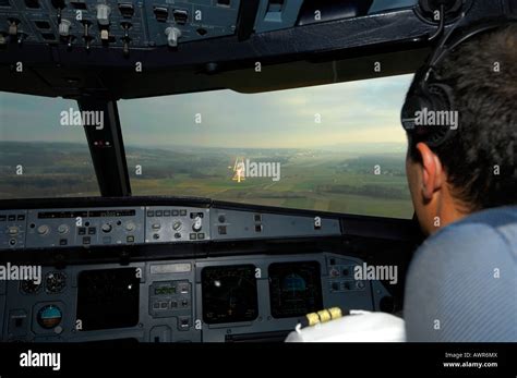 Pilots in the cockpit of an Airbus 321, approach Stock Photo - Alamy