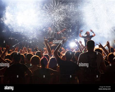 Cheering crowd at concert Stock Photo - Alamy