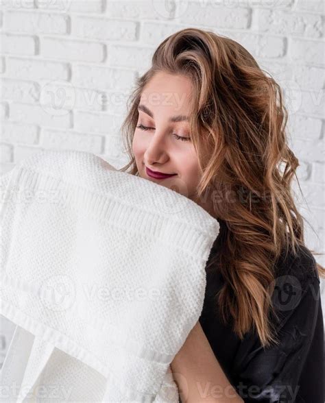 beautiful woman smelling clean clothes at home 4334920 Stock Photo at ...