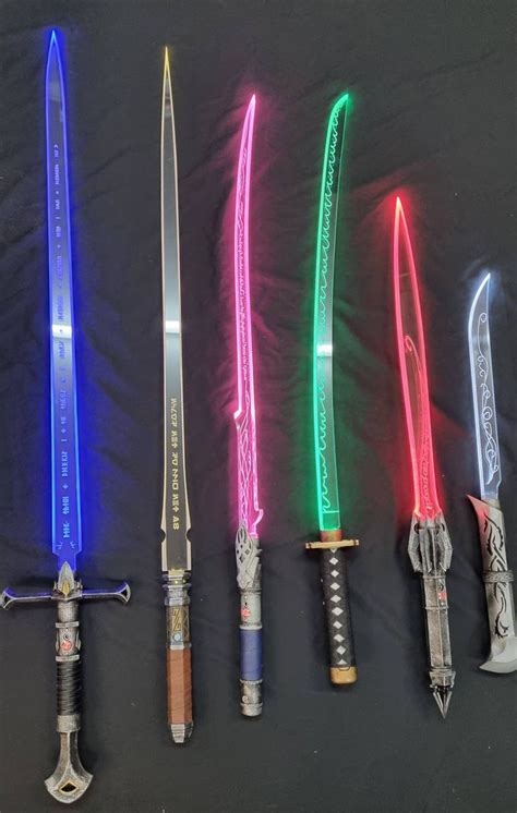 four different colored lightsabed swords are lined up in a row on a ...