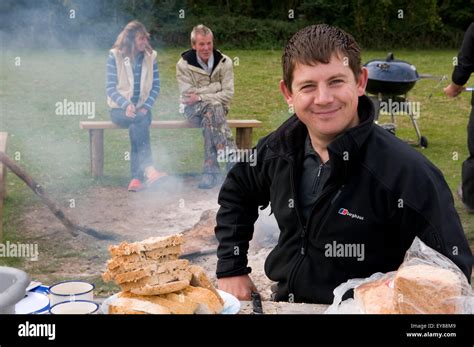 Young man smiling at the camera Stock Photo - Alamy