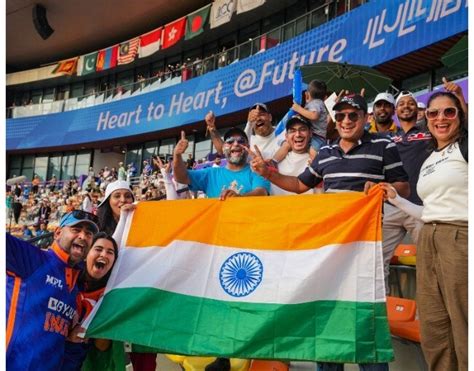 Indian fans celebrate after the women's cricket team win historic gold.