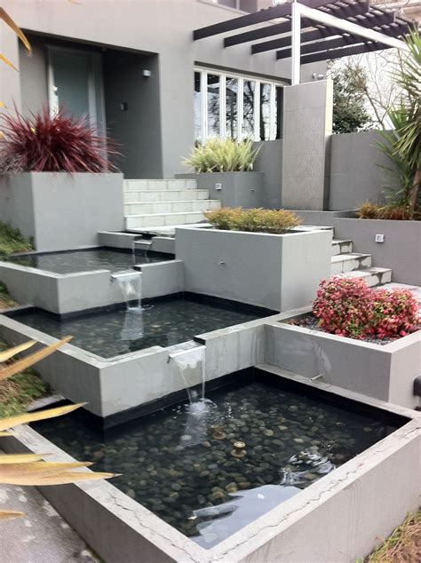 Stainless steel waterwall with linked base pond splillways | Water ...