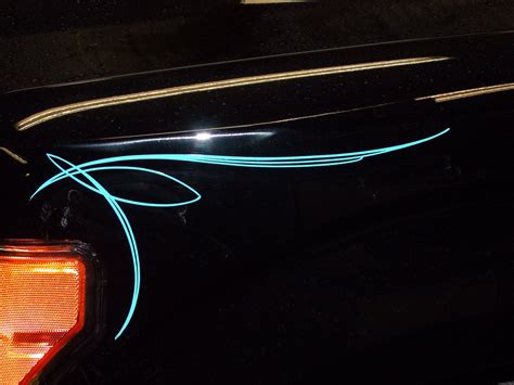 Black Car Tail Light with Blue Pinstripe Art