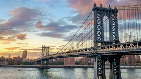 Manhattan Bridge over East River at sunset, New York City, USA ...