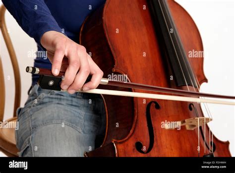 Cello or cellist close-up, showing the bow hold Stock Photo - Alamy