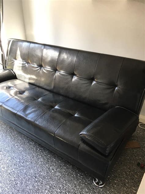 Black faux leather sofa bed | in Killamarsh, South Yorkshire | Gumtree