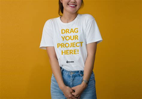 Smiling Girl wearing T-Shirt Mockup - Mockup World