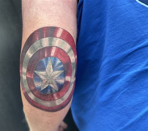 Captain America Shield Elbow Tattoo | Shield tattoo, Captain america ...