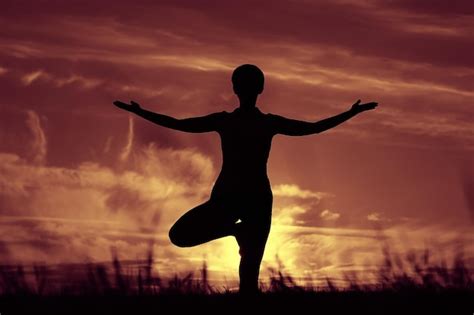 Premium Photo | Silhouette of a young girl yoga pose sunset sport